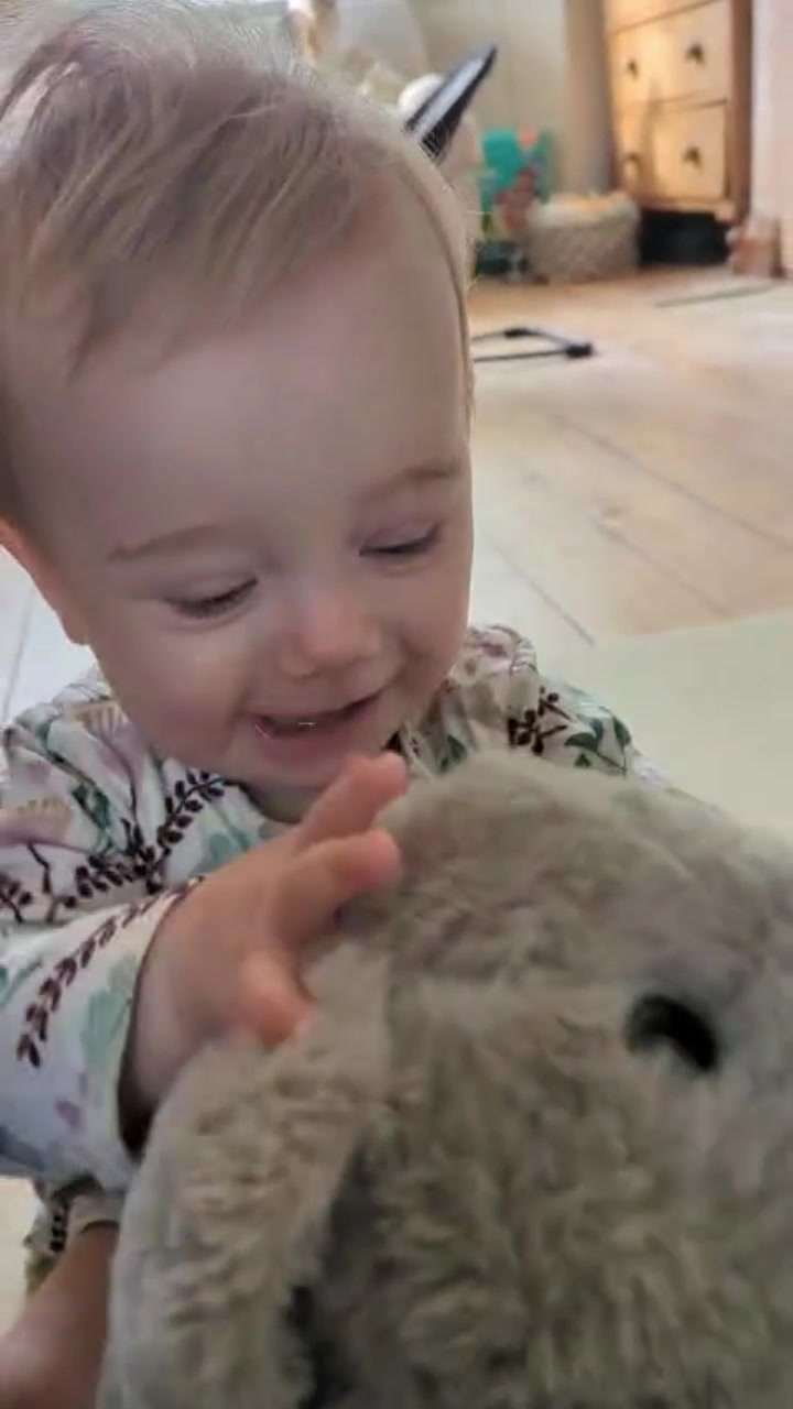 A contributor holding a teddy, captured from the actual finished Wave